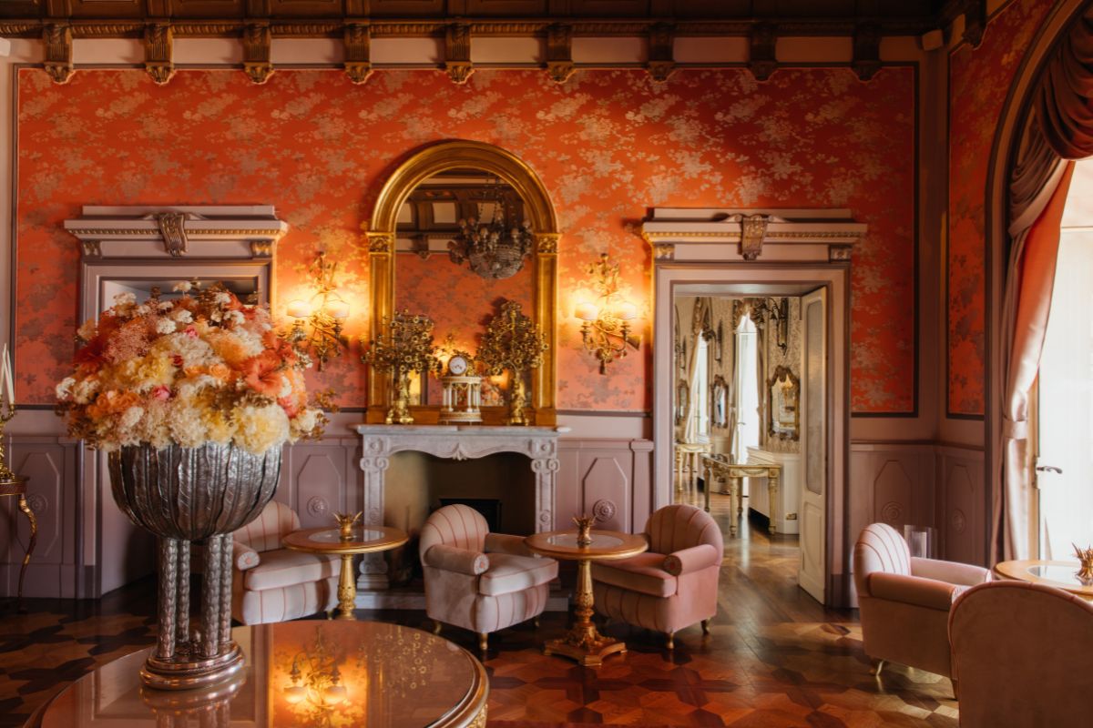 a room with a fireplace and chairs