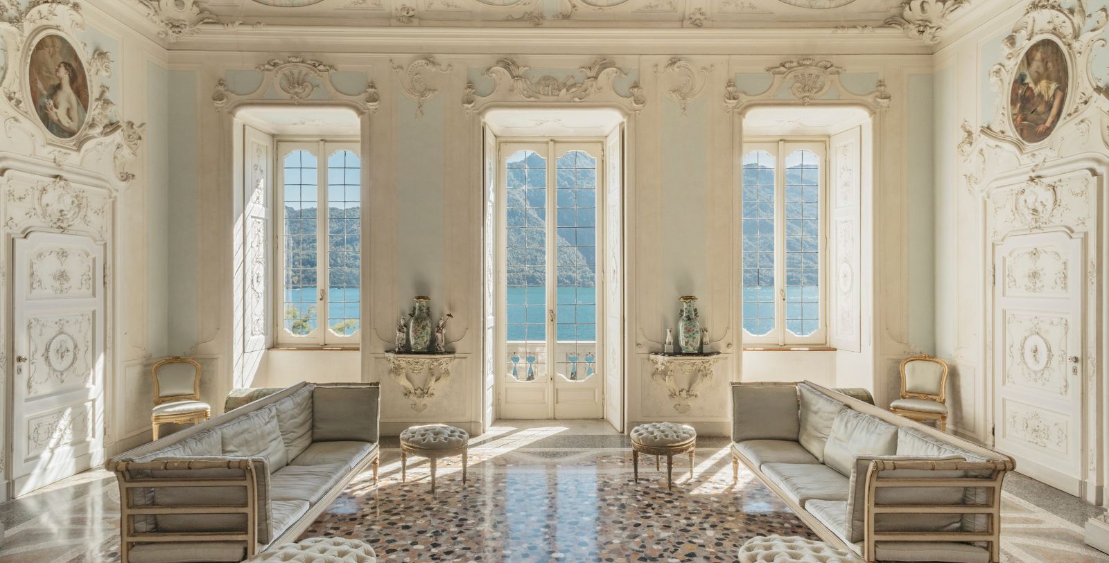 a room with white walls and a large window