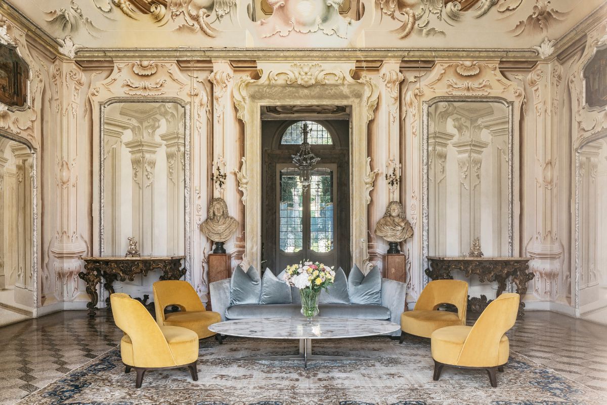 a room with a round table and chairs