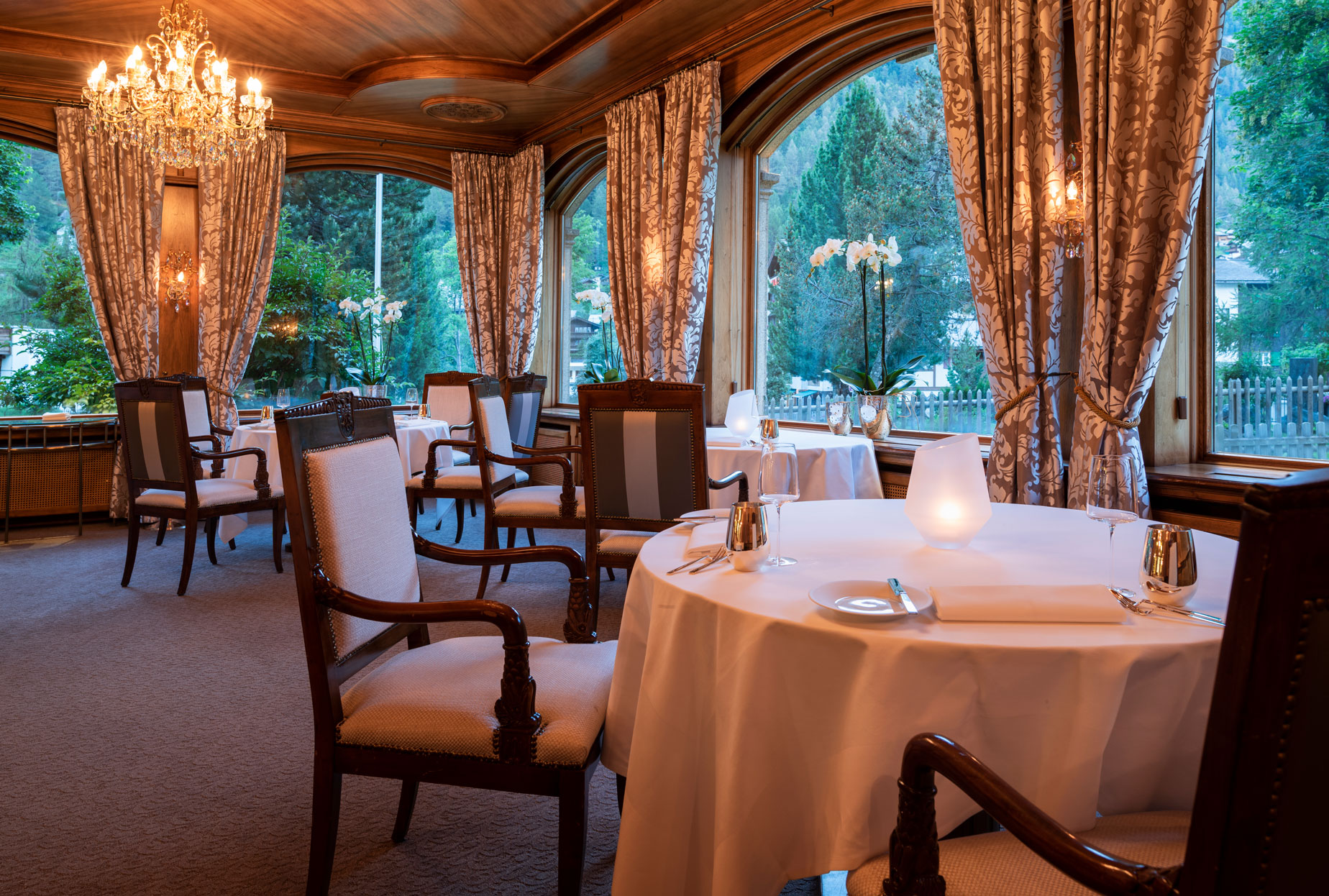 a restaurant with tables and chairs