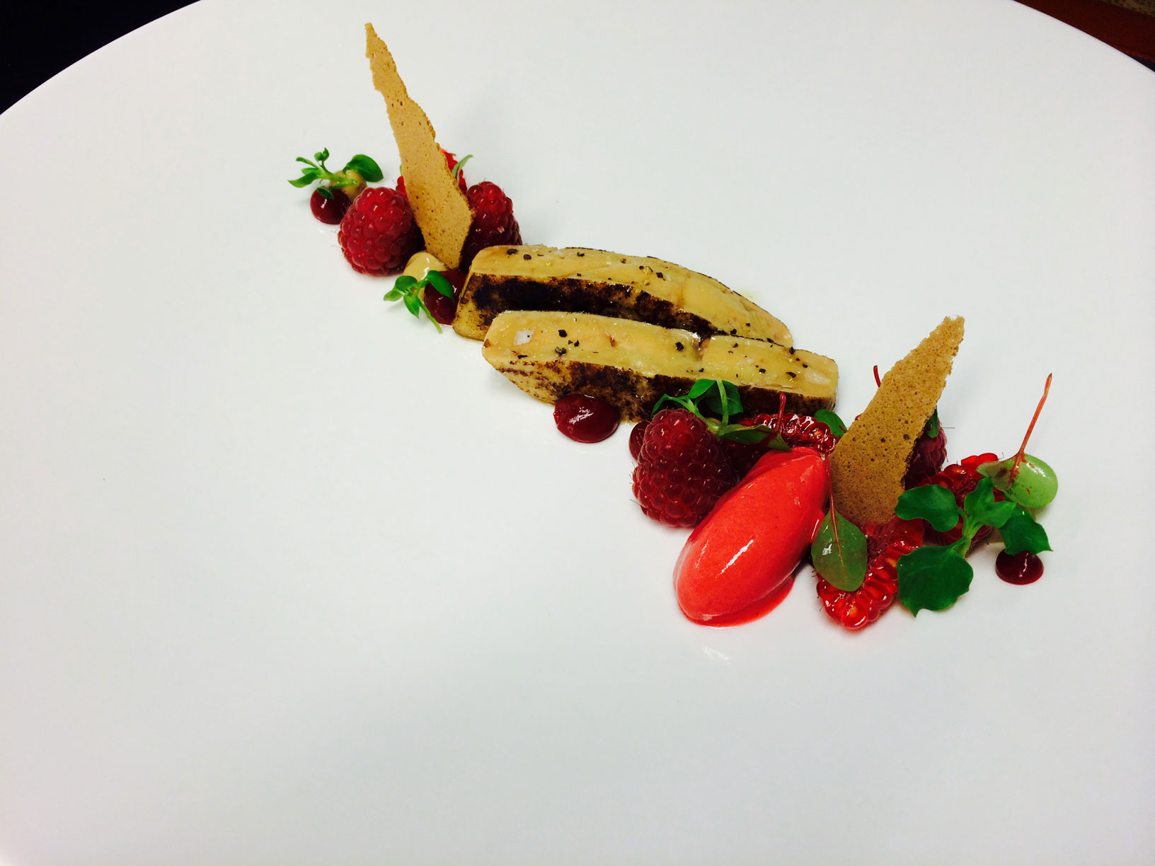 a plate of food on a white surface