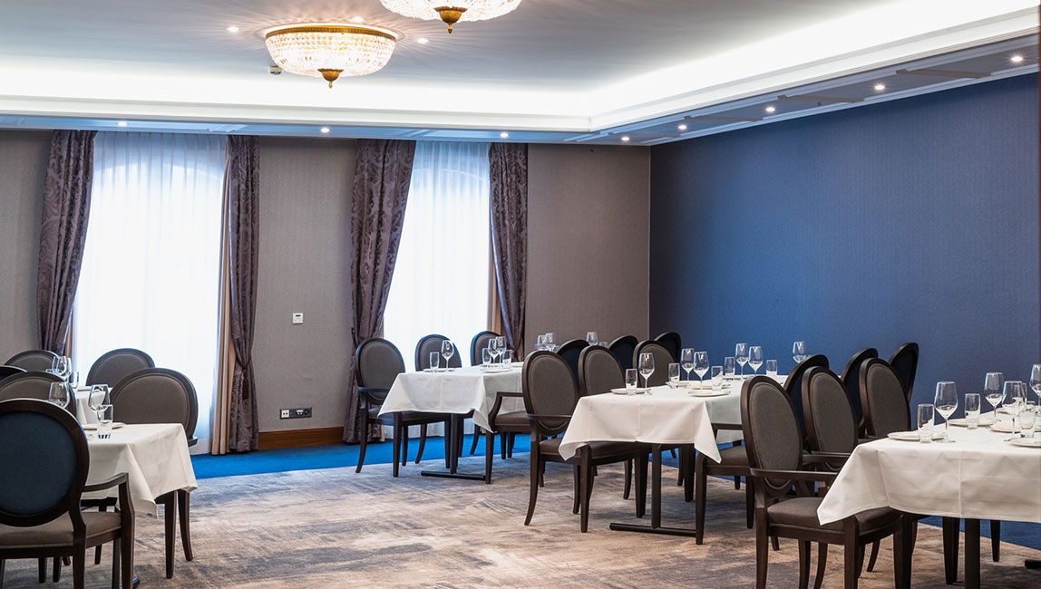 a room with tables and chairs