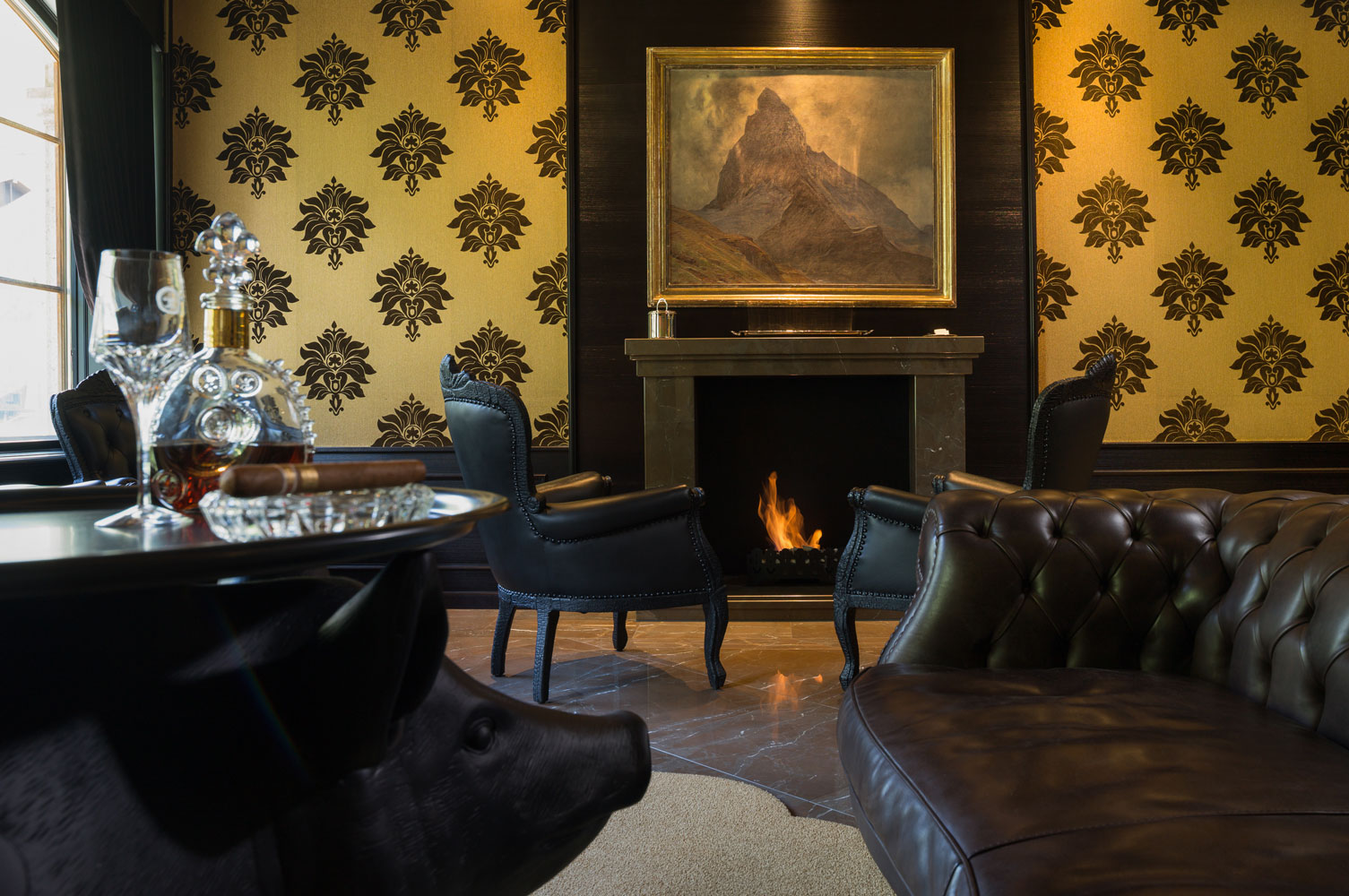 a room with a fireplace and a painting