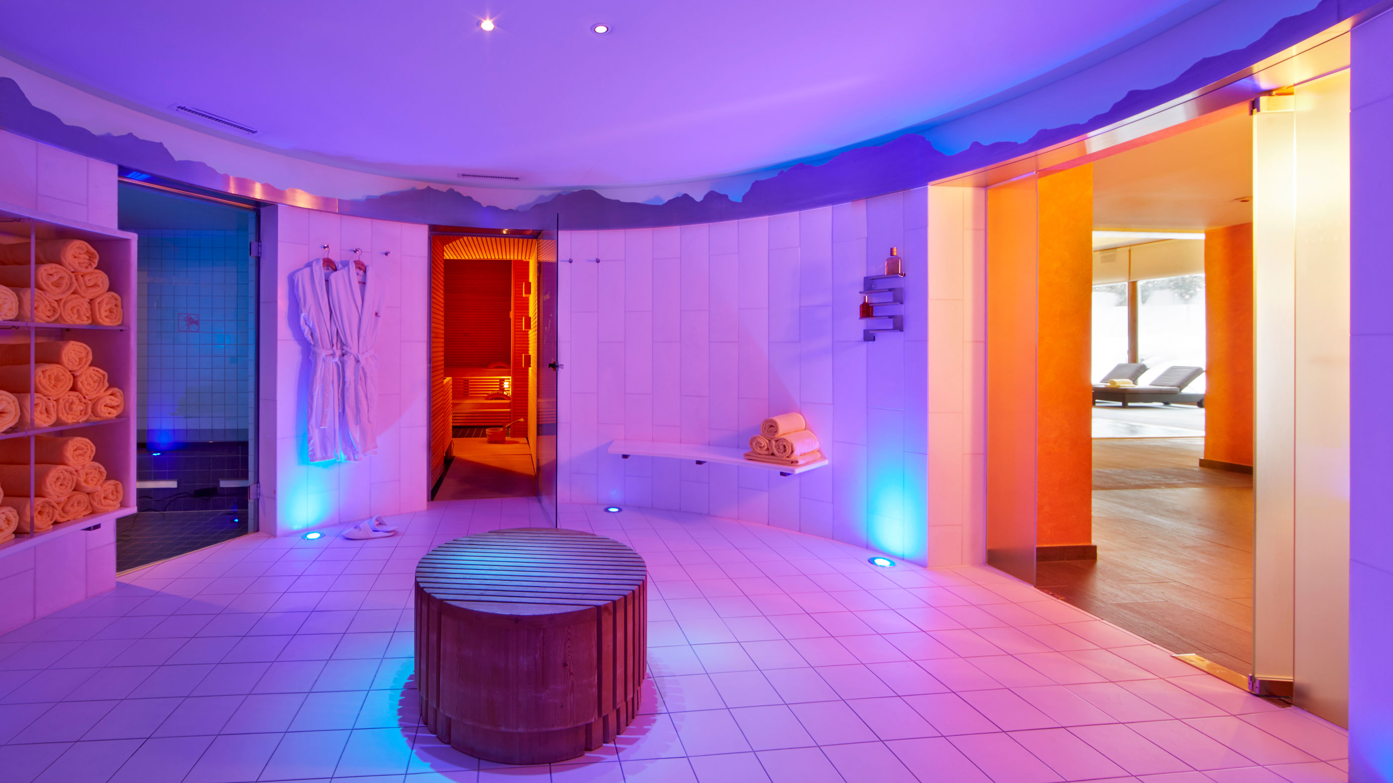a room with a round table and towels