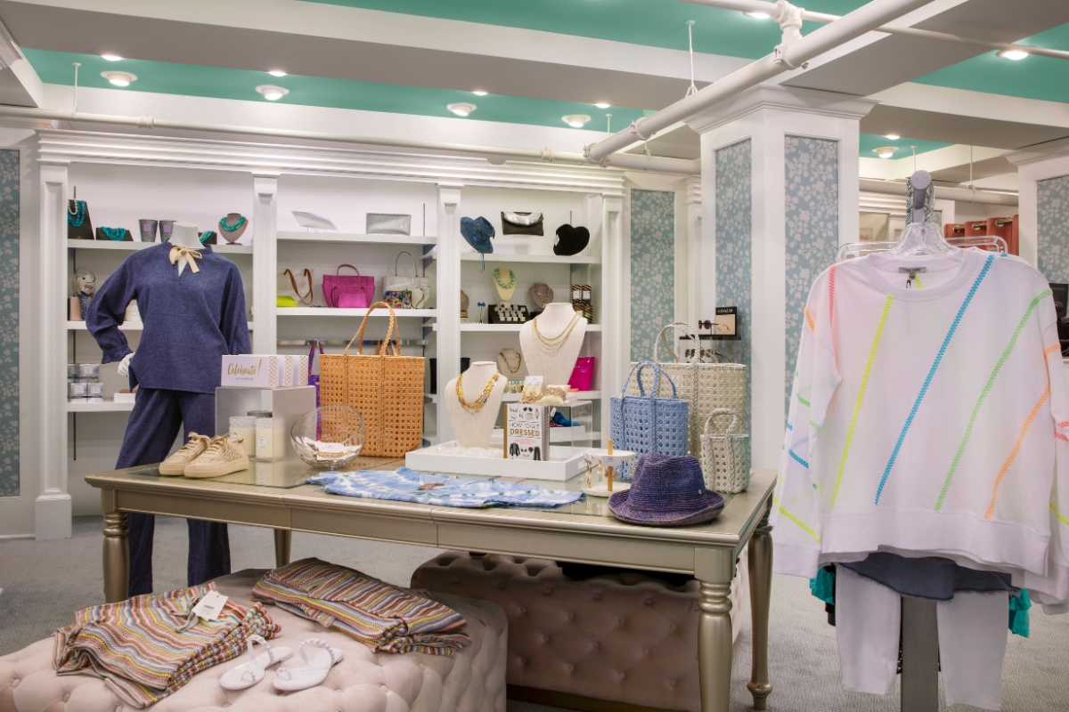 a store with a table with clothes and accessories