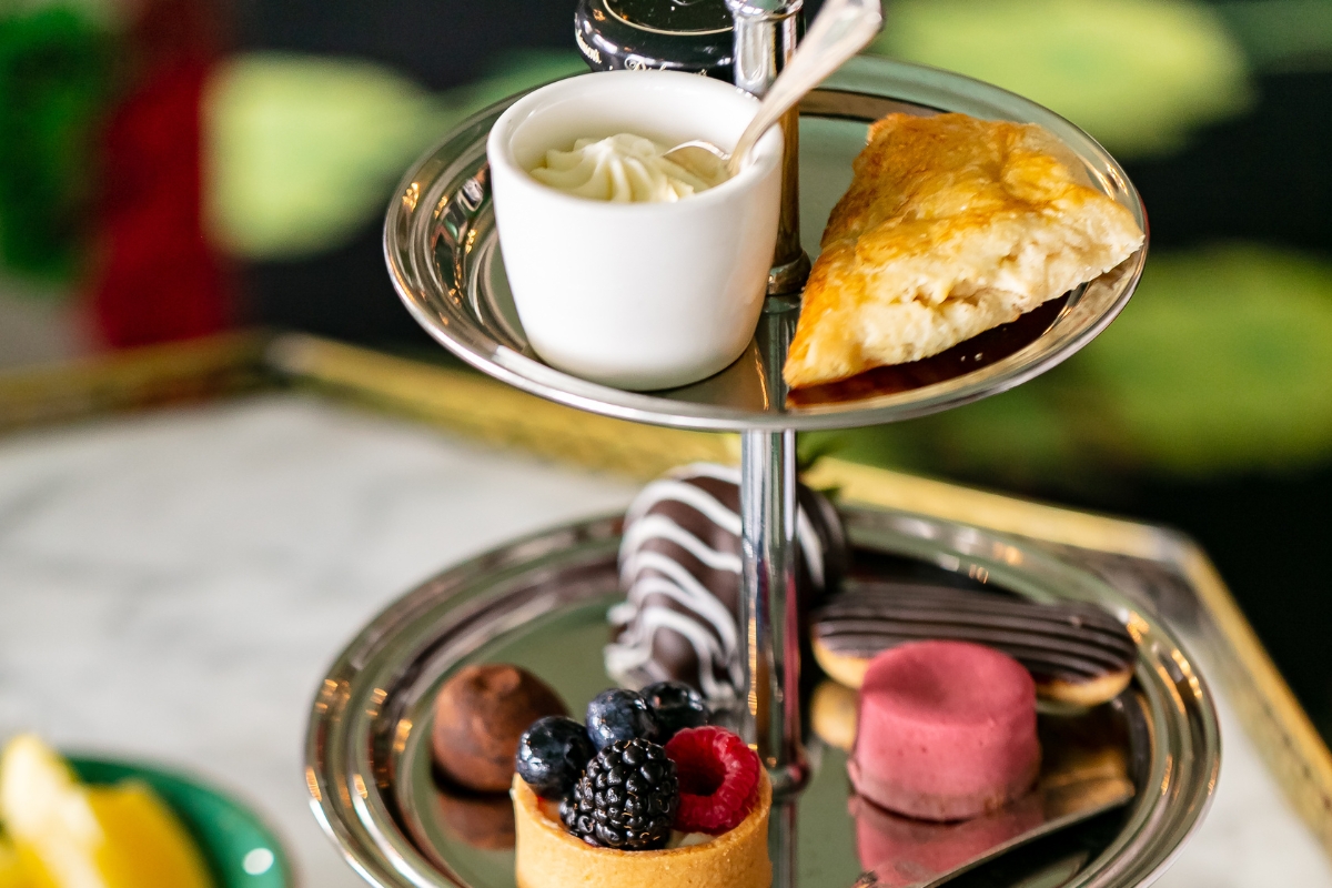 a tray of desserts and pastries