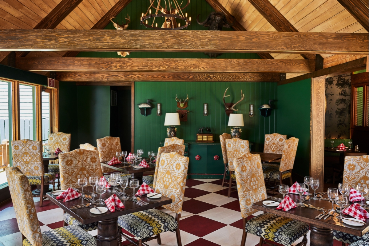 a room with a checkered floor and a chandelier