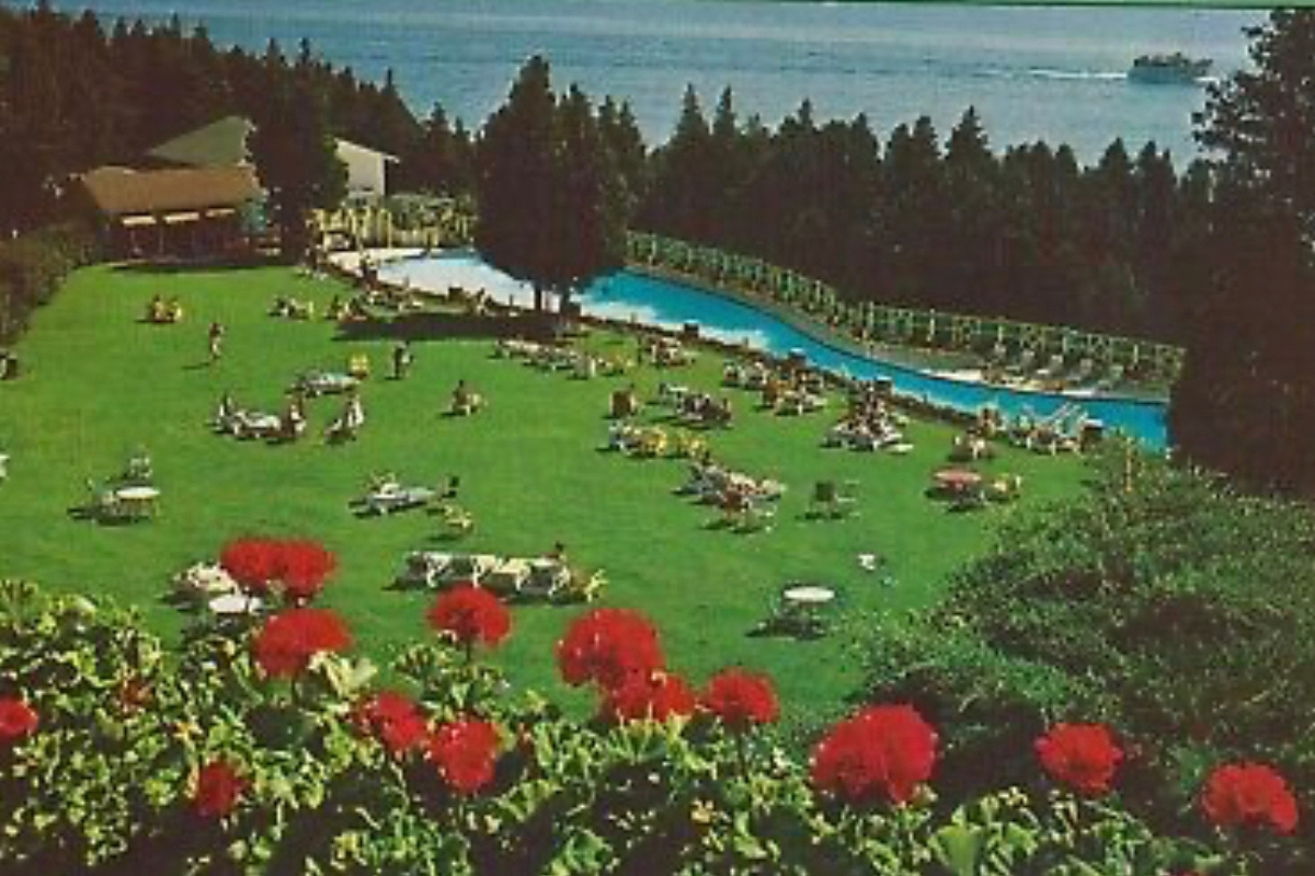 a large lawn with people sitting on it