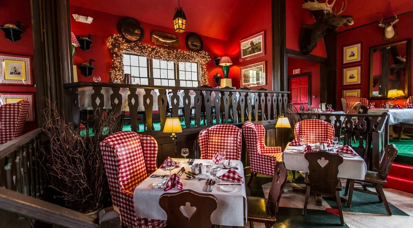 a restaurant with red walls and red chairs