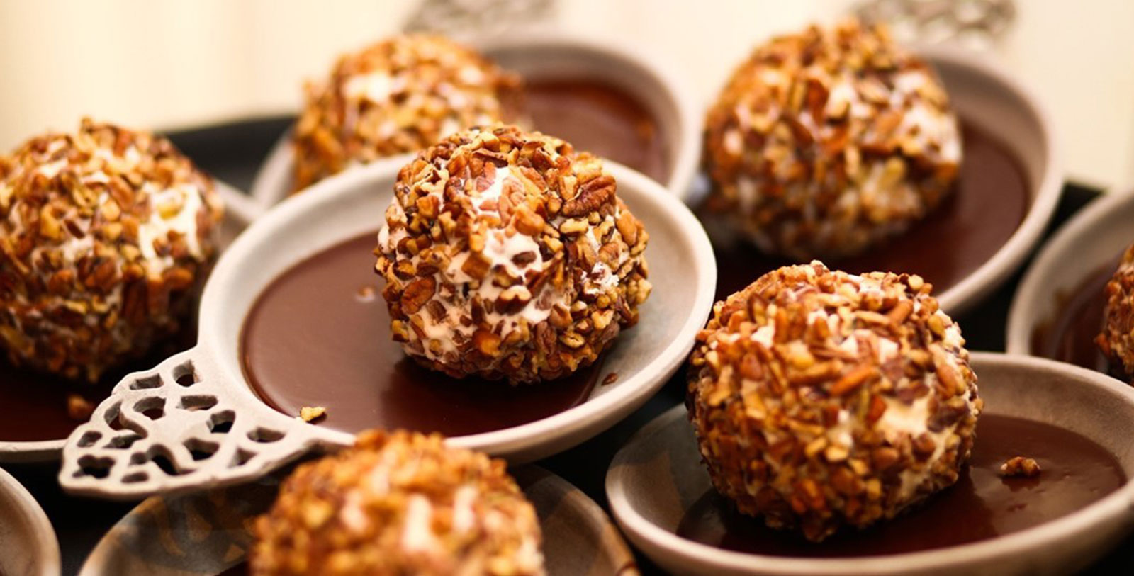 a group of round brown and white desserts