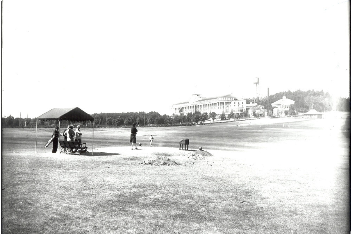 a group of people standing on a field