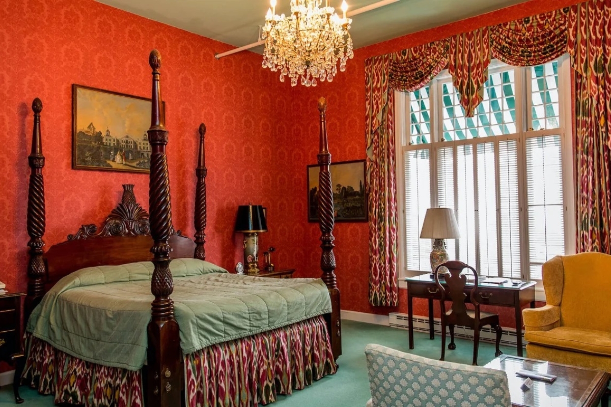 a room with a bed and a desk