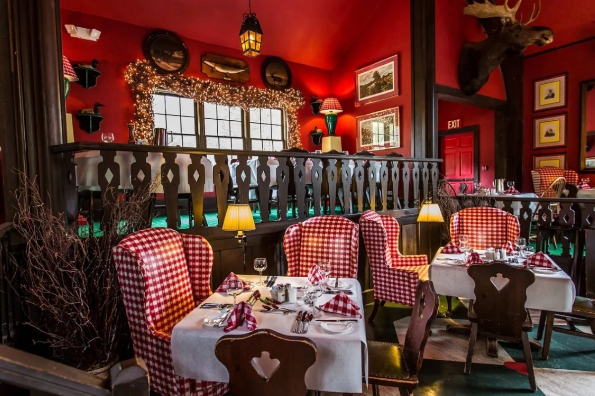 a restaurant with red walls and red chairs