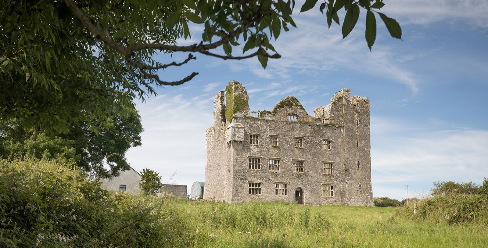 a stone building with a large window