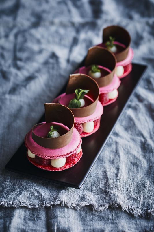 a plate of desserts on a gray cloth