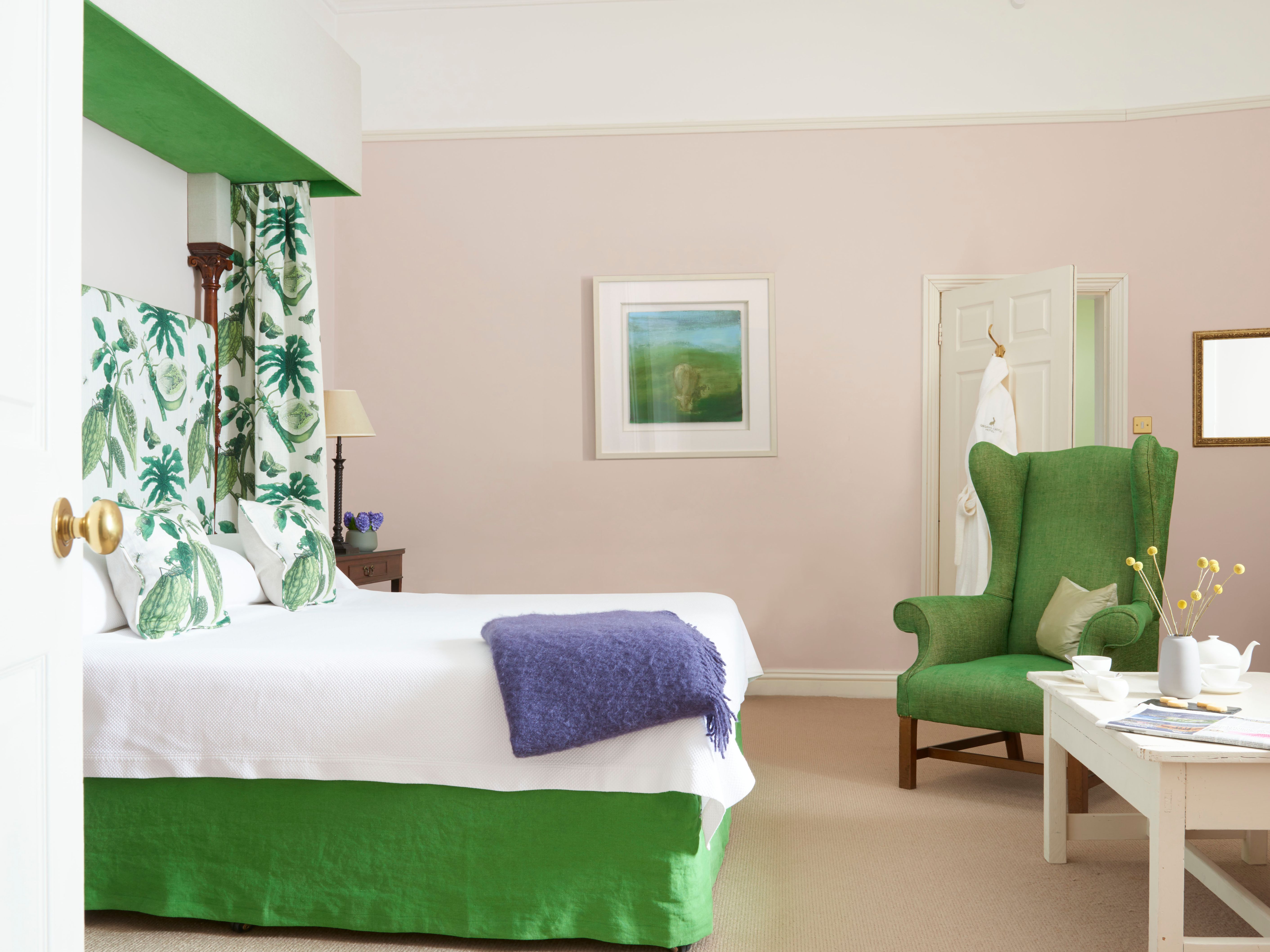a room with a bed and a chair