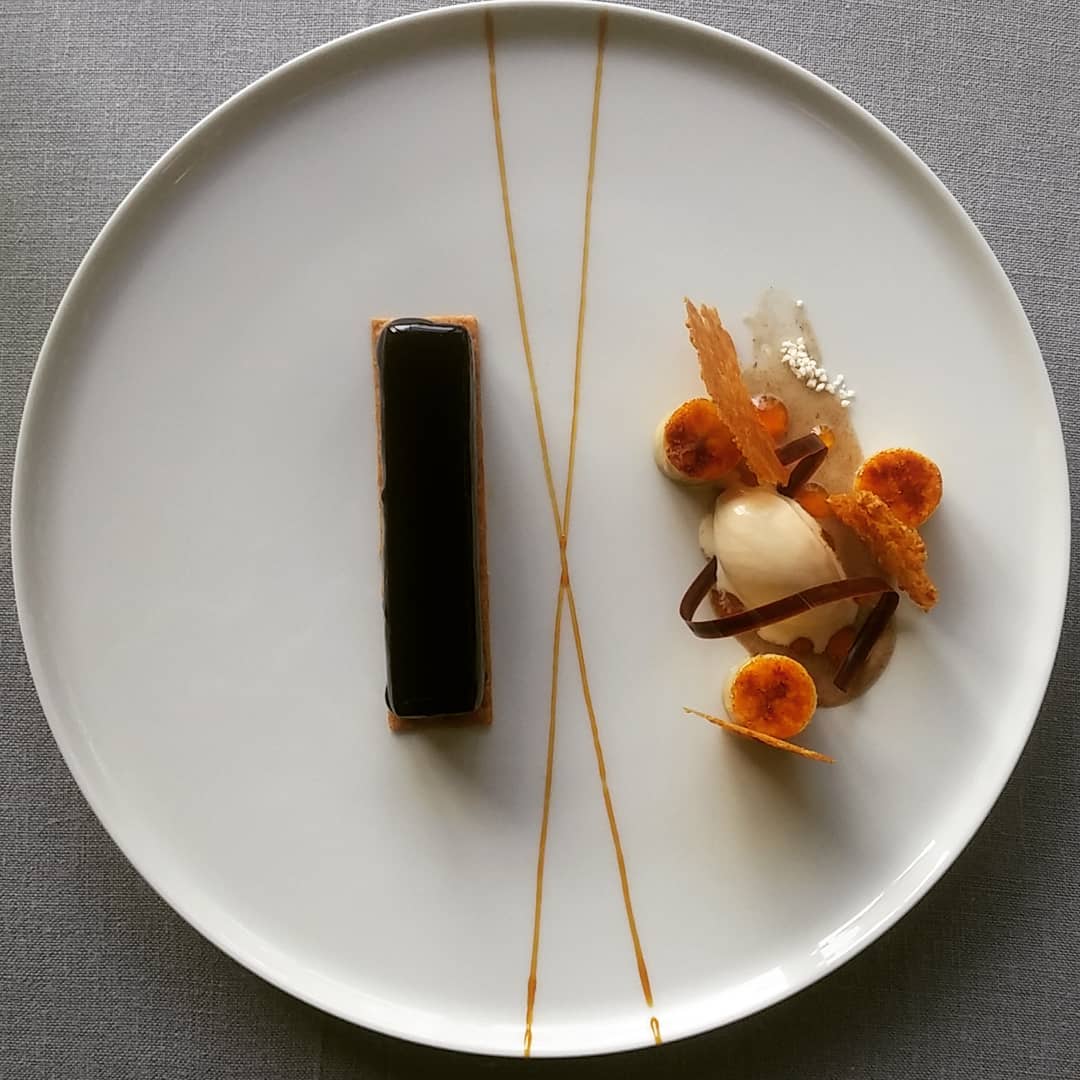 a plate of desserts on a gray surface