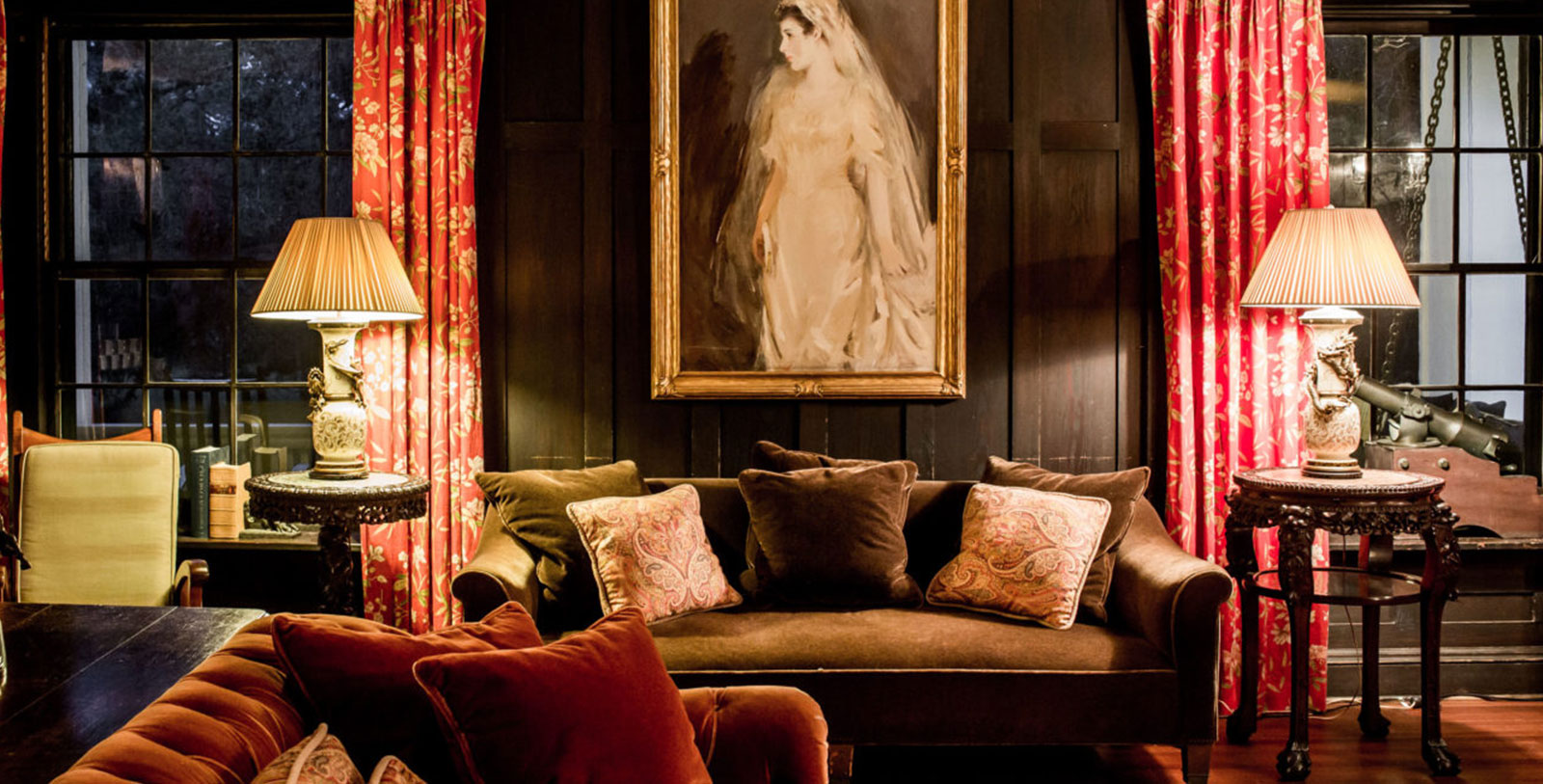 a room with a painting of a woman