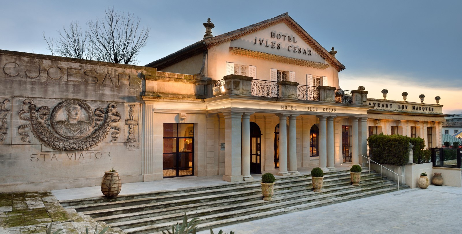 a building with columns and a sign