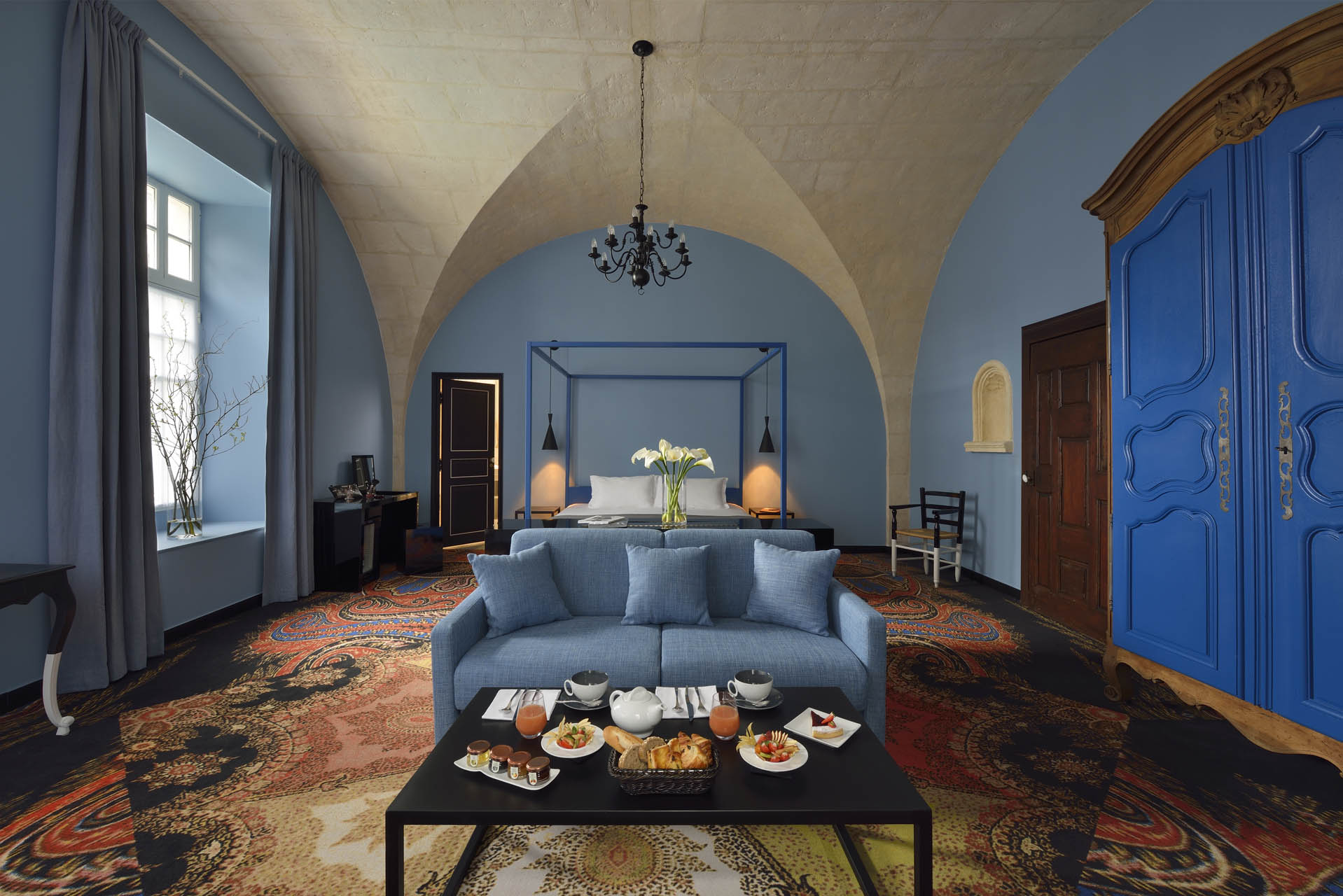 a room with a bed and a couch