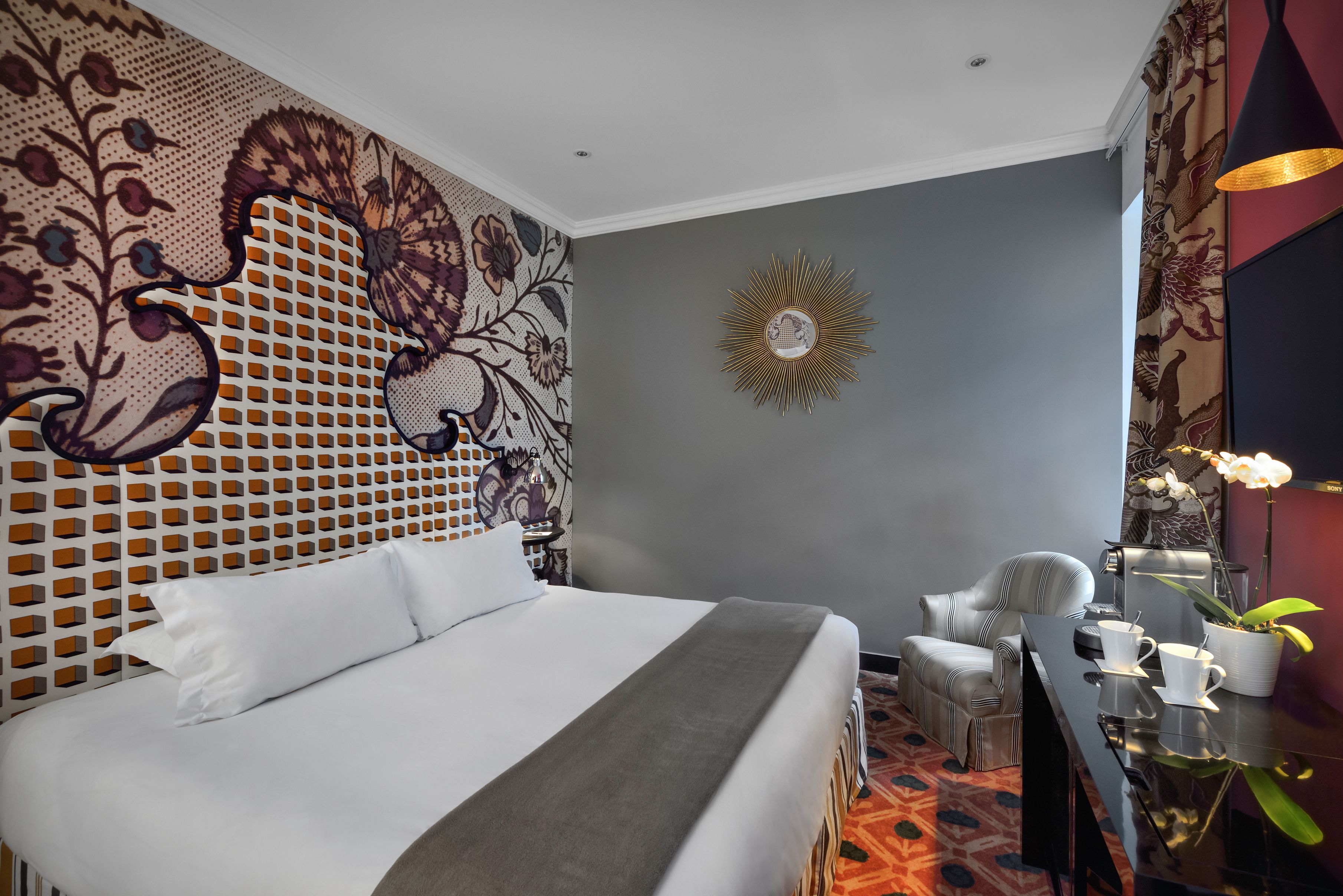 a room with a bed and a desk