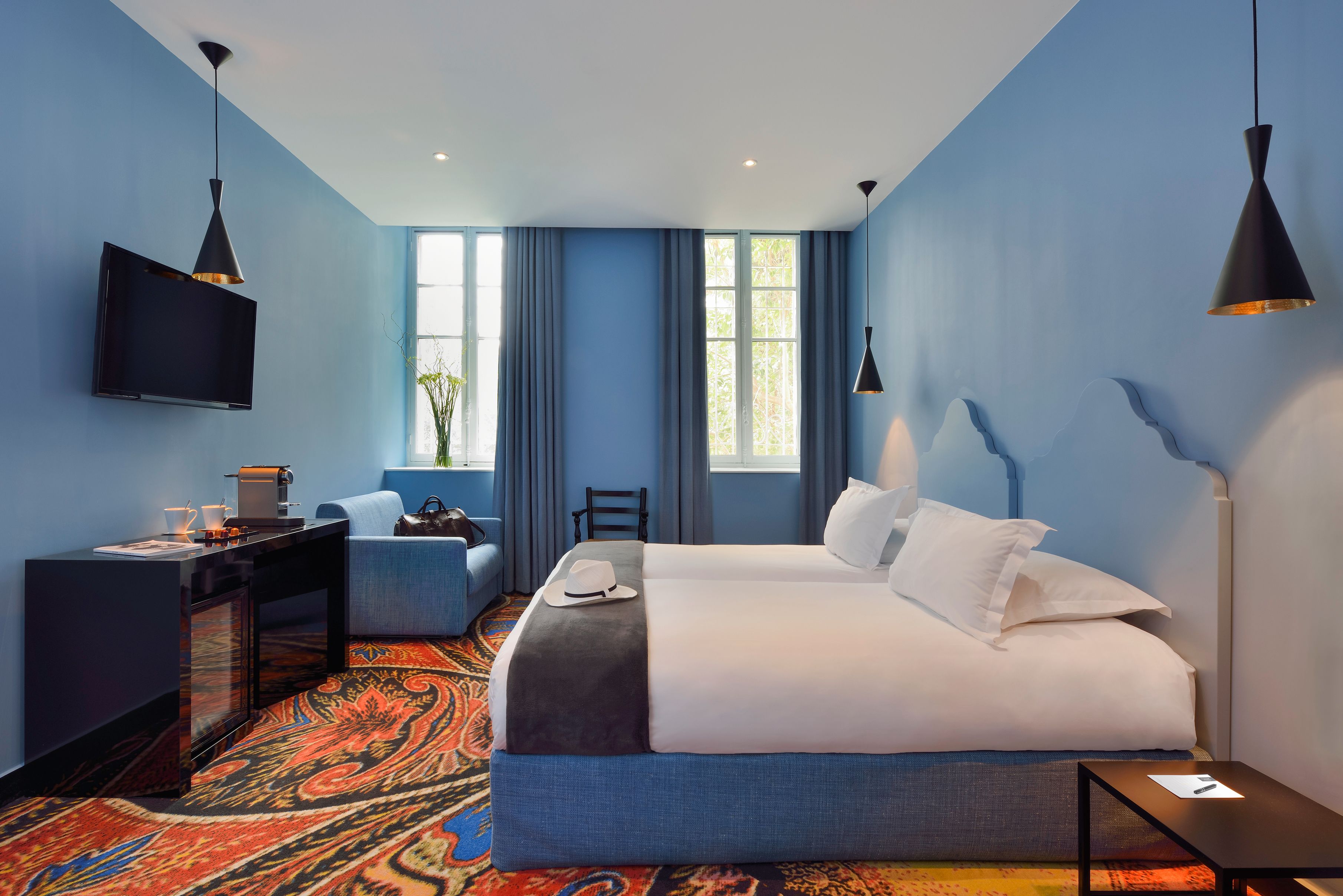 a room with a bed and a fireplace