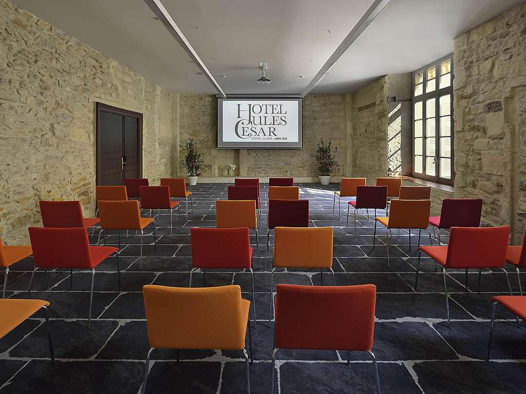 a room with chairs and a projector screen