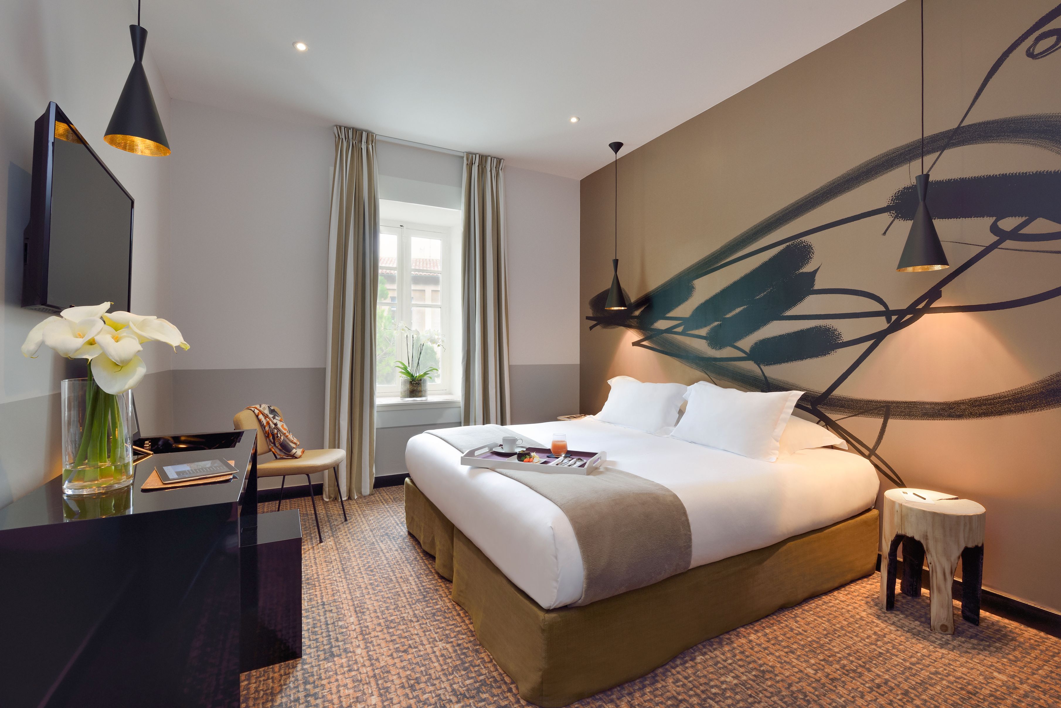 a room with a bed and a desk