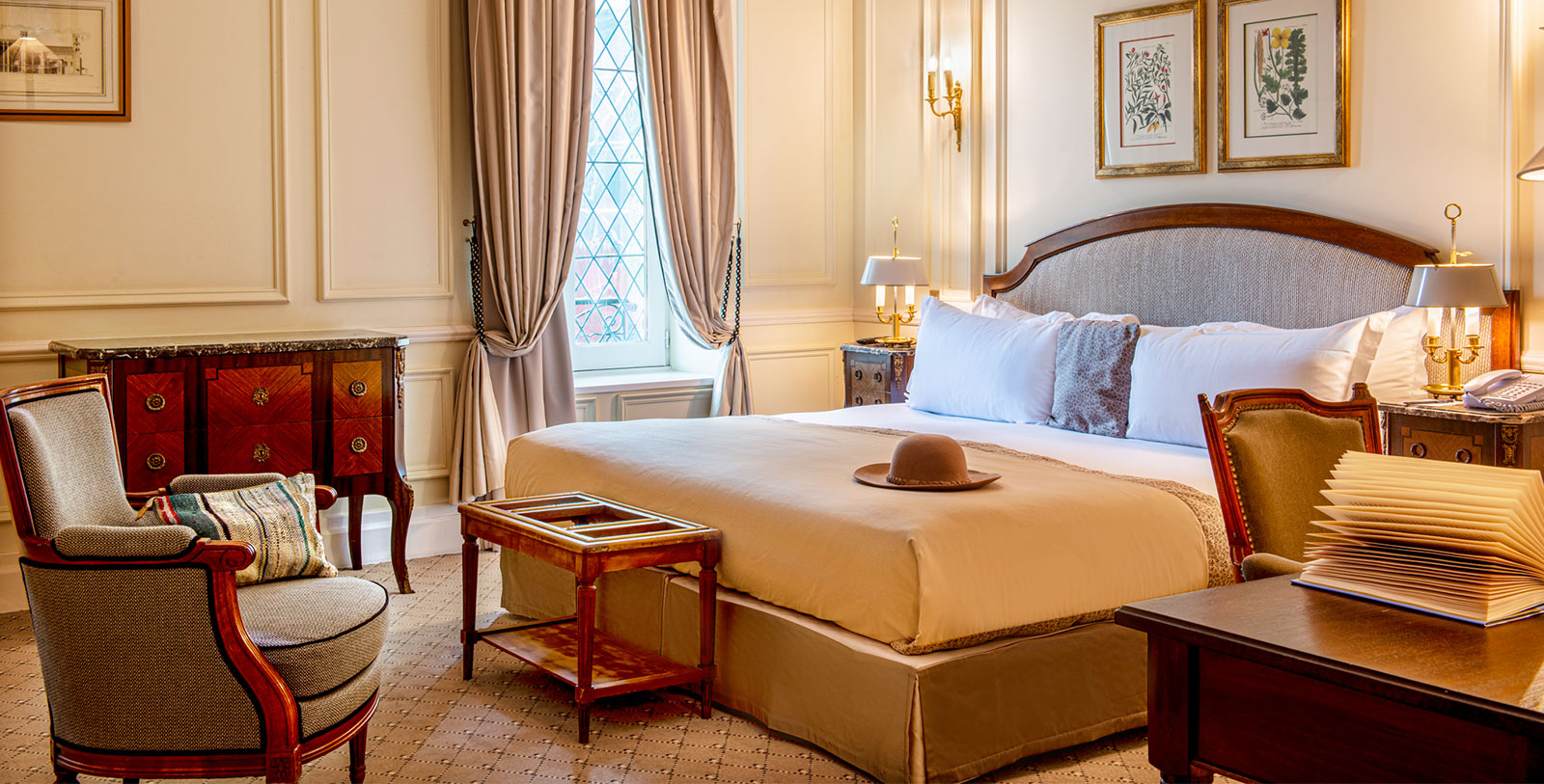 a bedroom with a bed and a hat on it