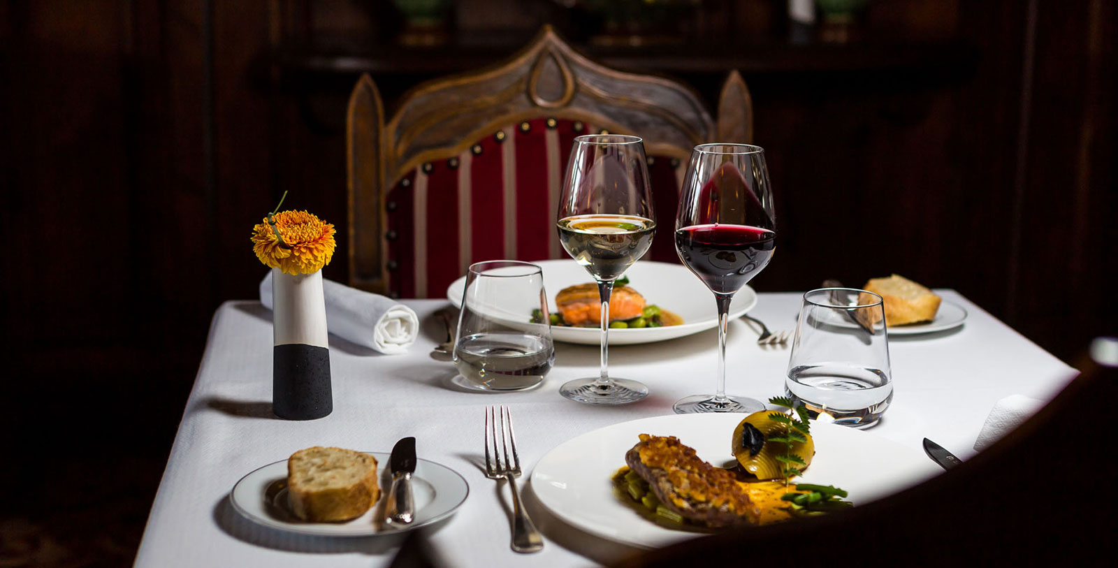 a table with wine glasses and food on it