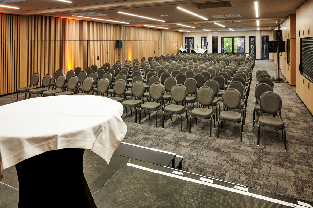 a room with a round table and chairs