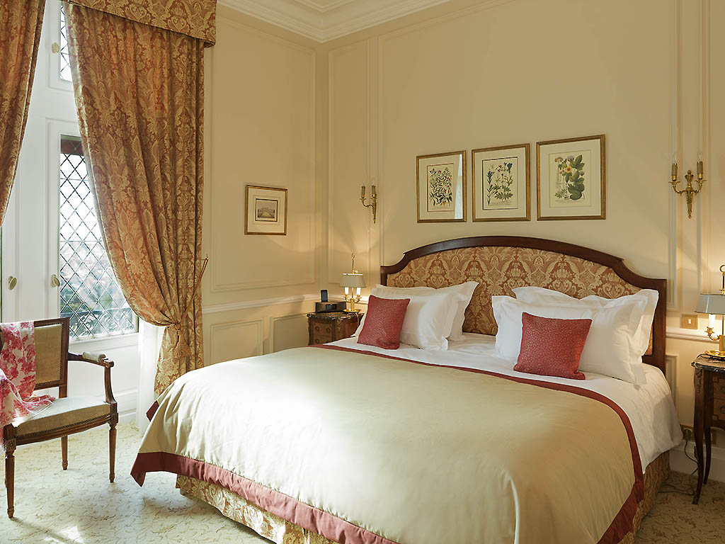 a bedroom with a bed and chair