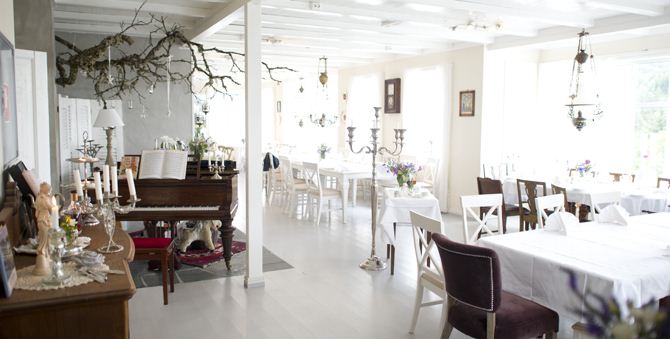 a room with a piano and chairs
