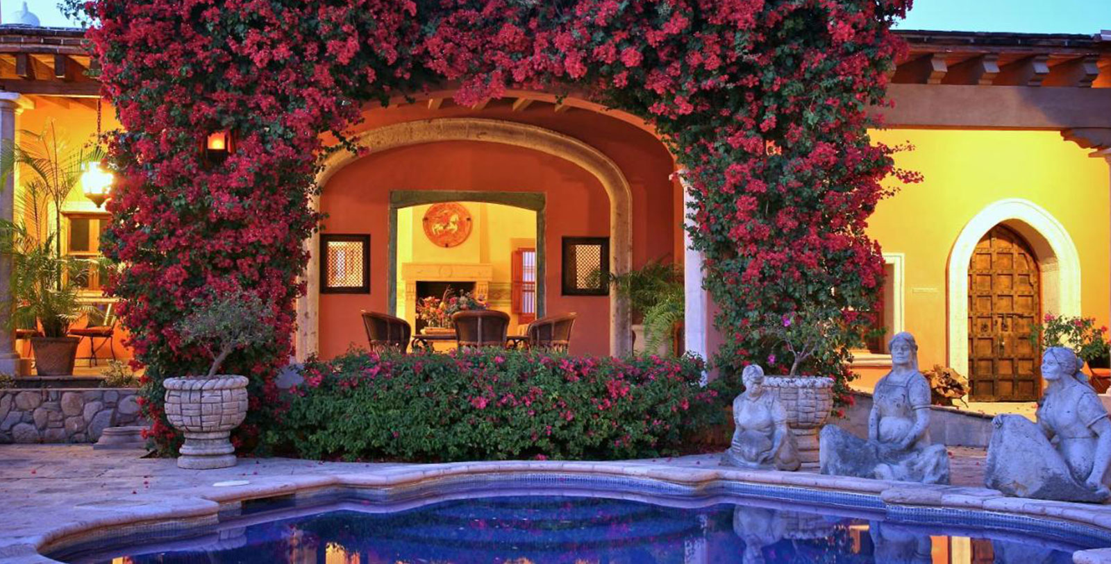 a pool with flowers around it
