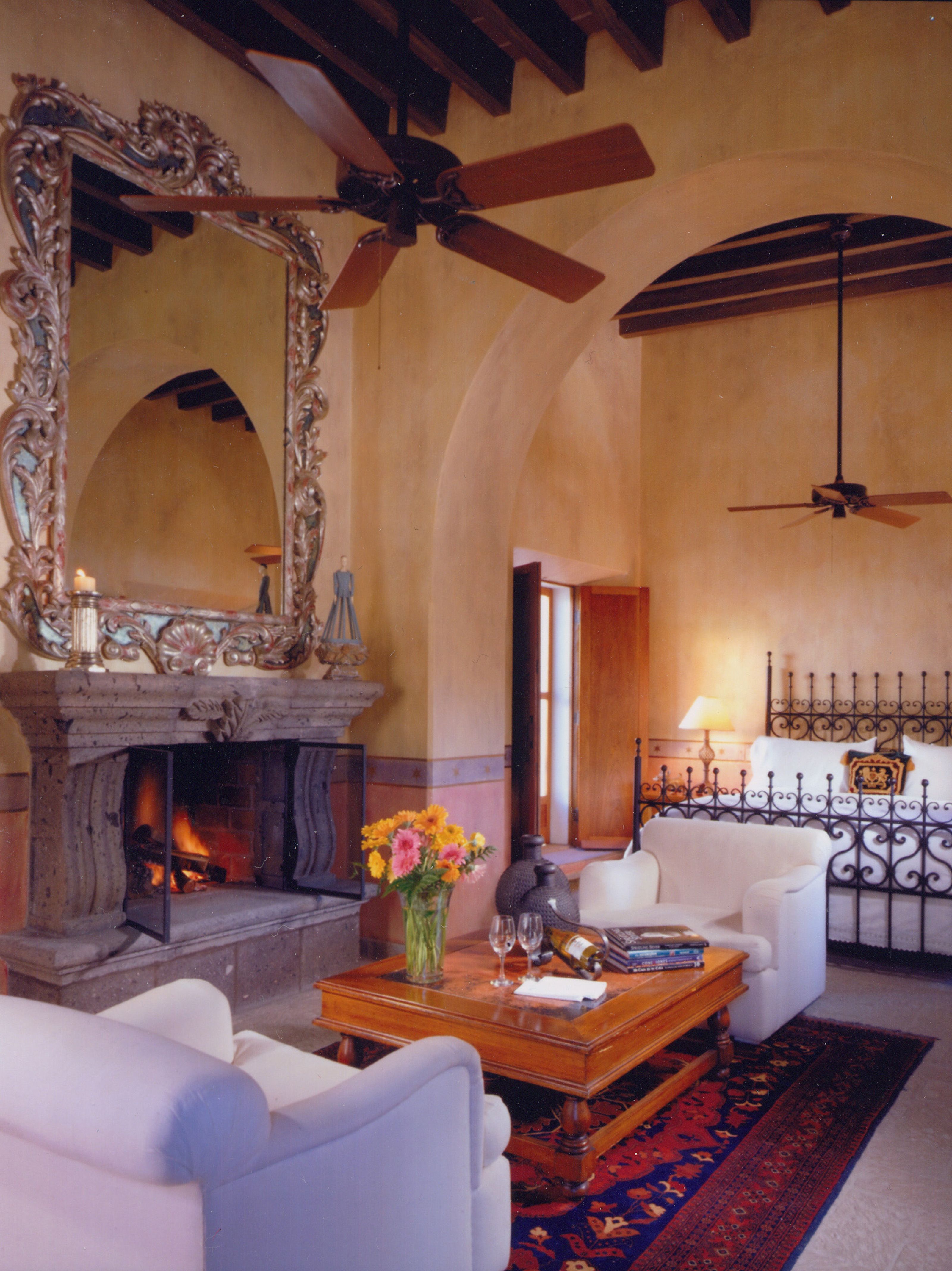 a room with a fireplace and a bed