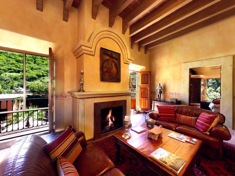 a living room with a fireplace and a couch