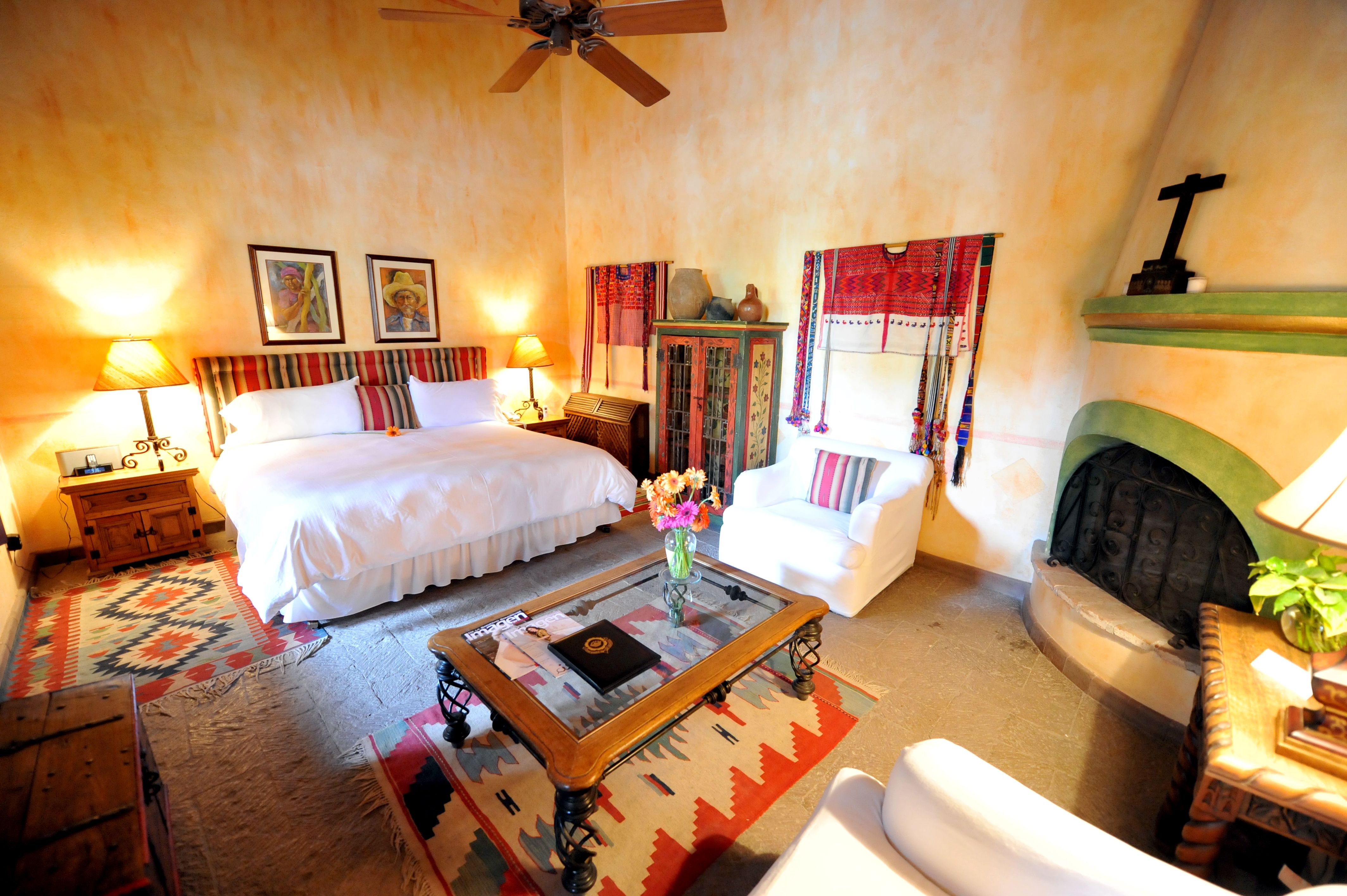 a room with a bed and a fireplace