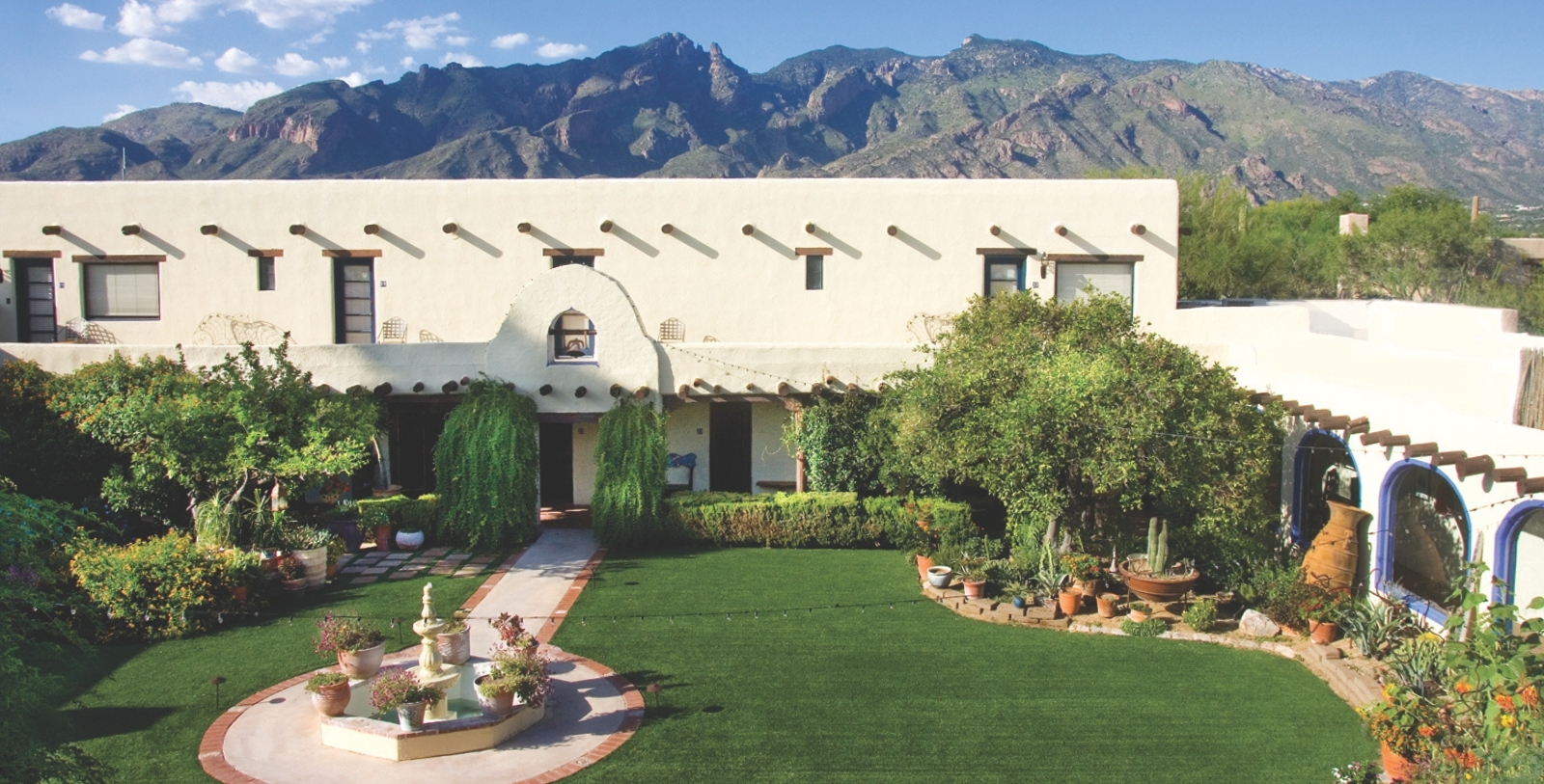 a building with a lawn and a fountain