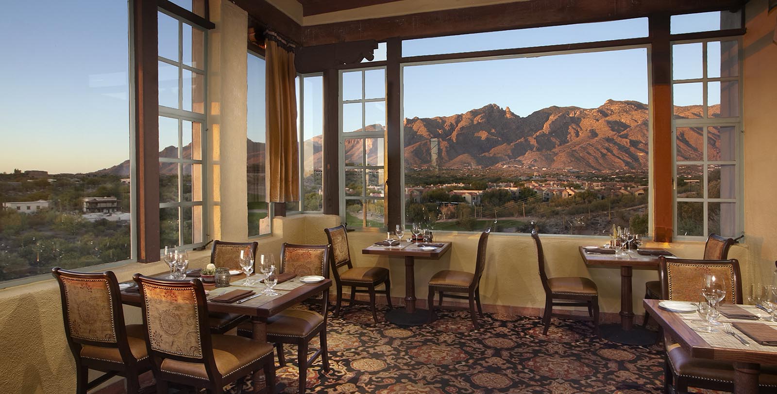 a restaurant with a view of the mountains