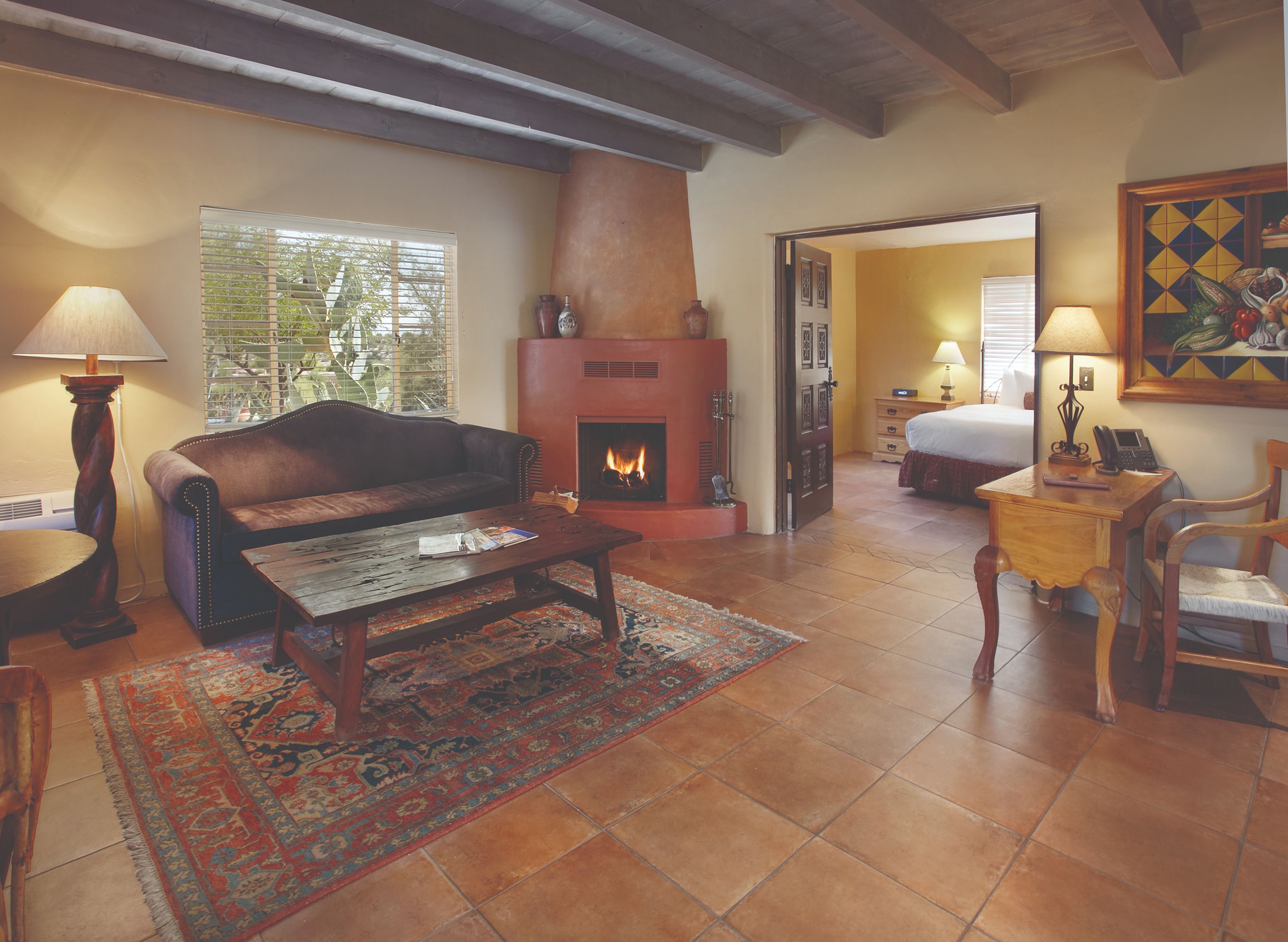 a living room with a couch and a fireplace
