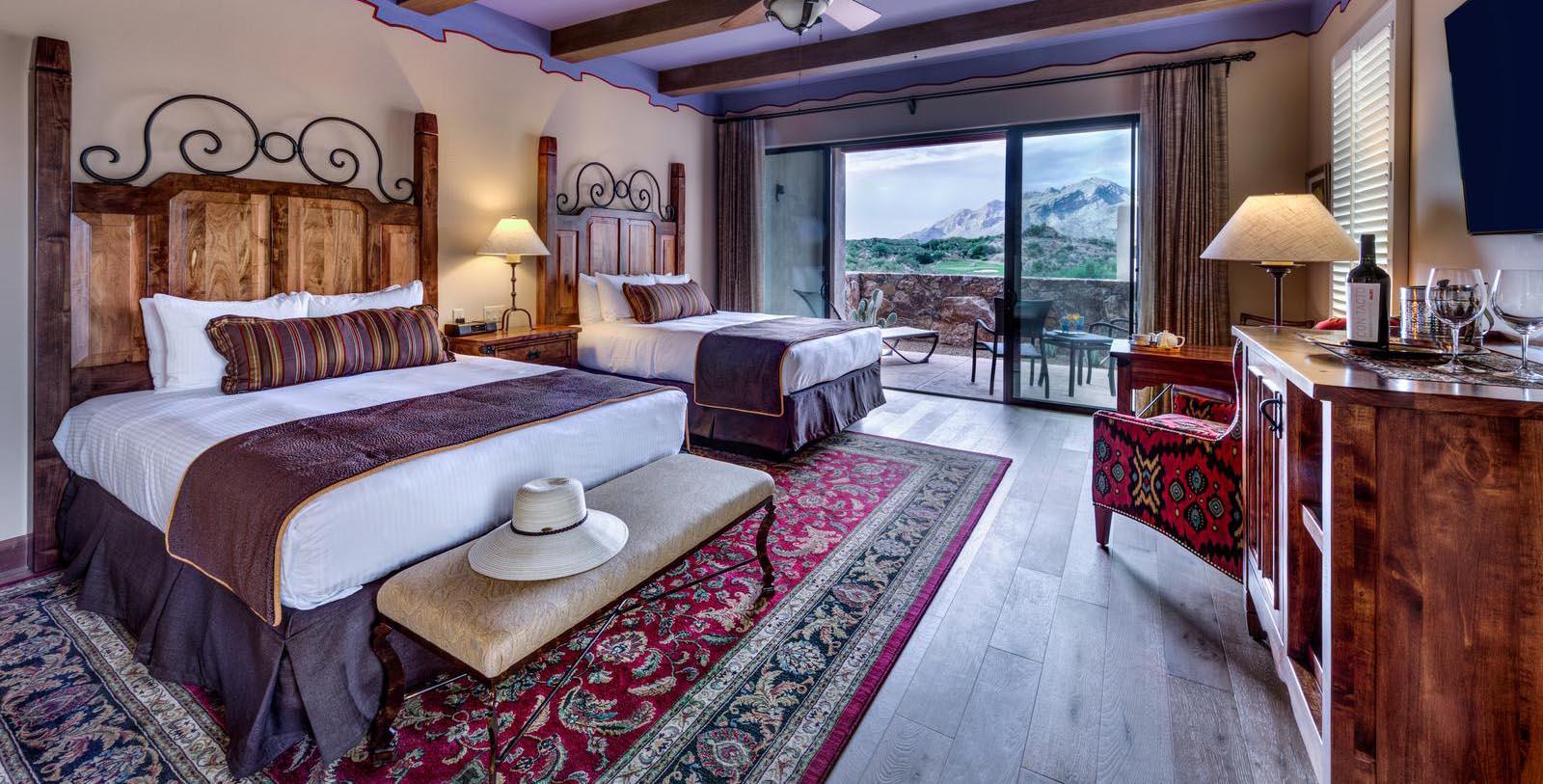 a room with two beds and a window