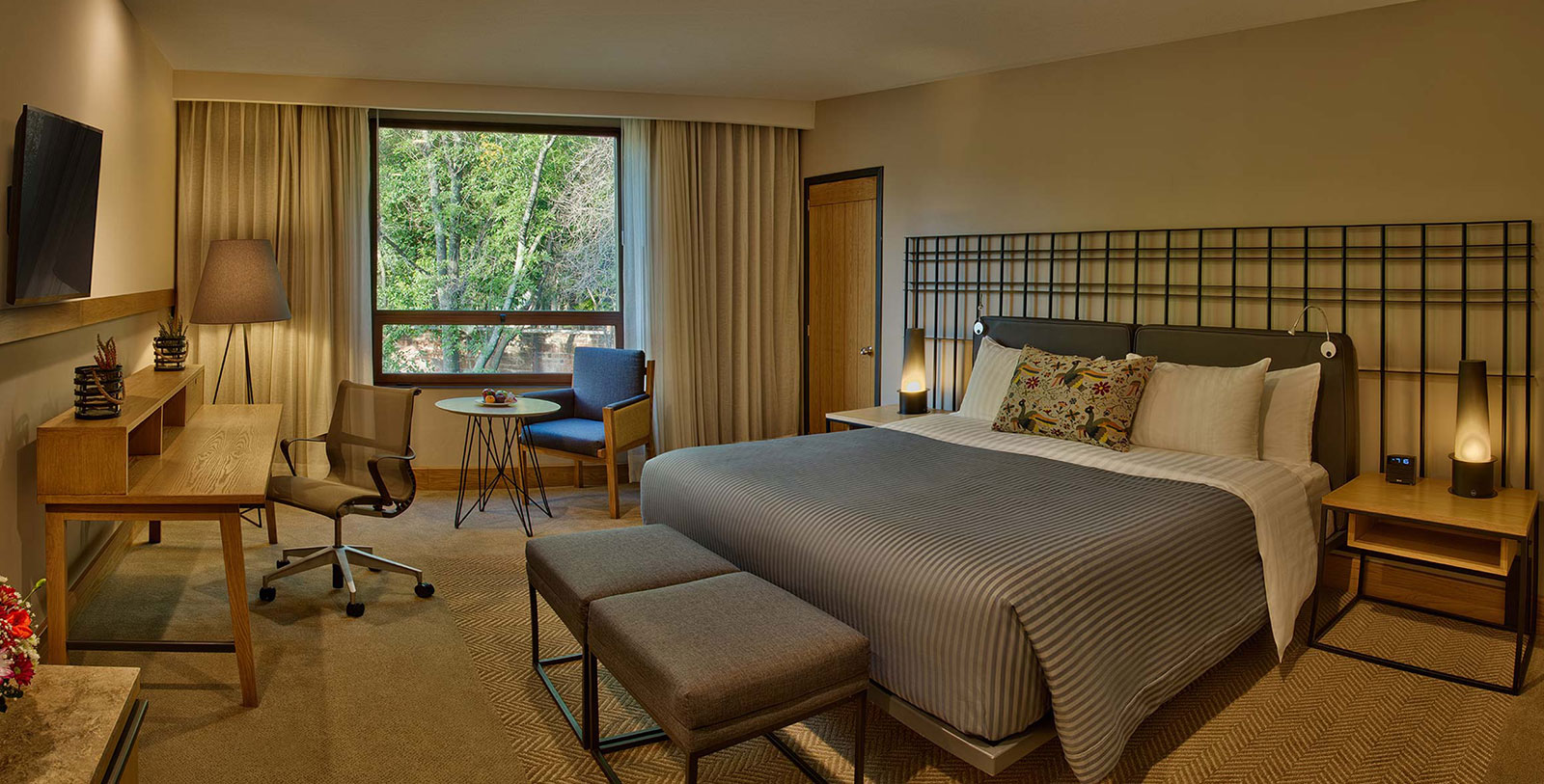 a bedroom with a bed and a chair