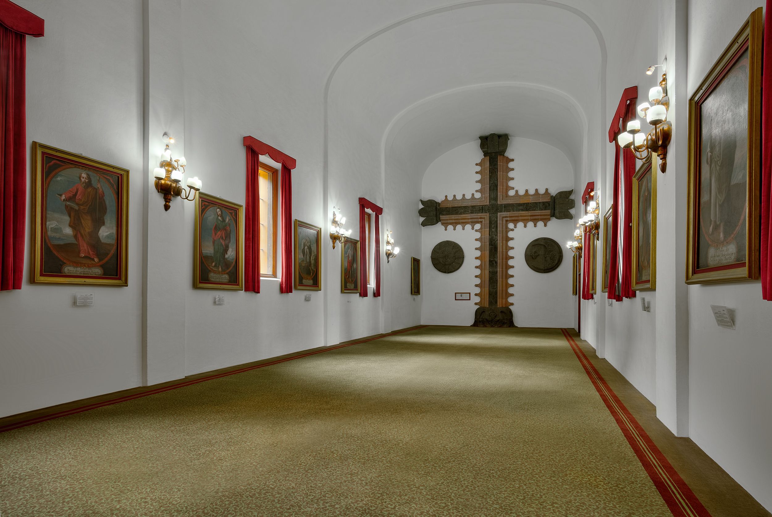 a room with a cross on the wall