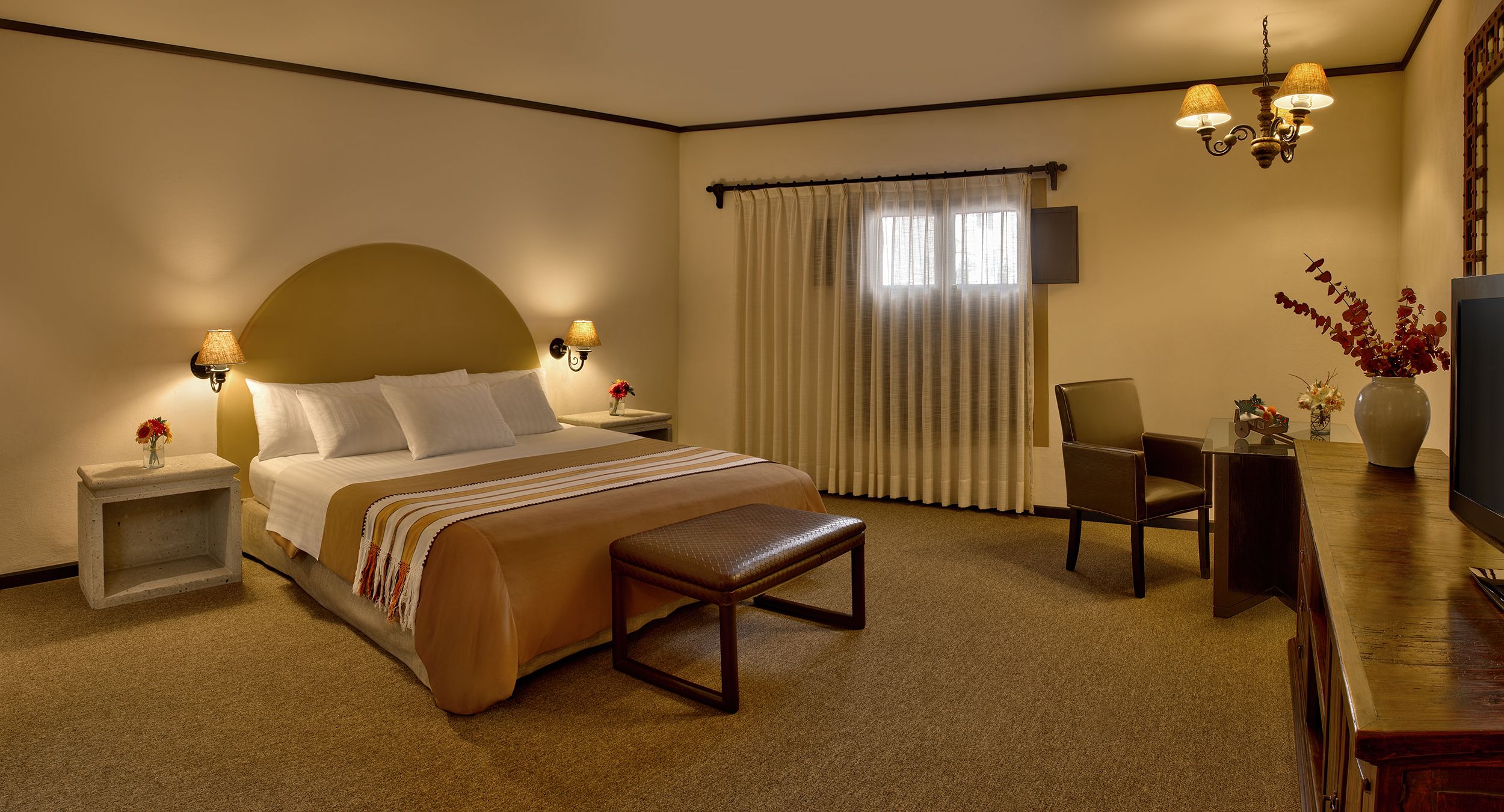 a bedroom with a bed and a chair