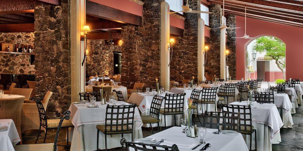 a restaurant with tables and chairs