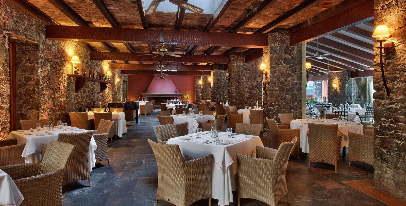 a restaurant with tables and chairs