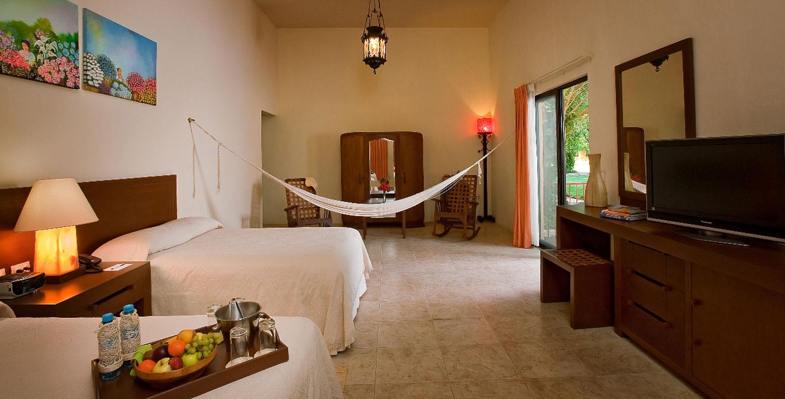 a hammock over a bed in a room
