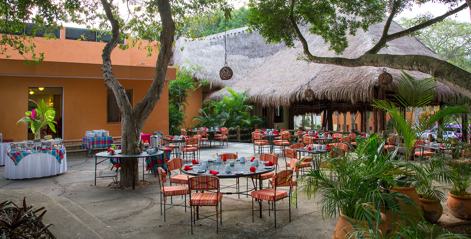 a group of tables and chairs outside a building