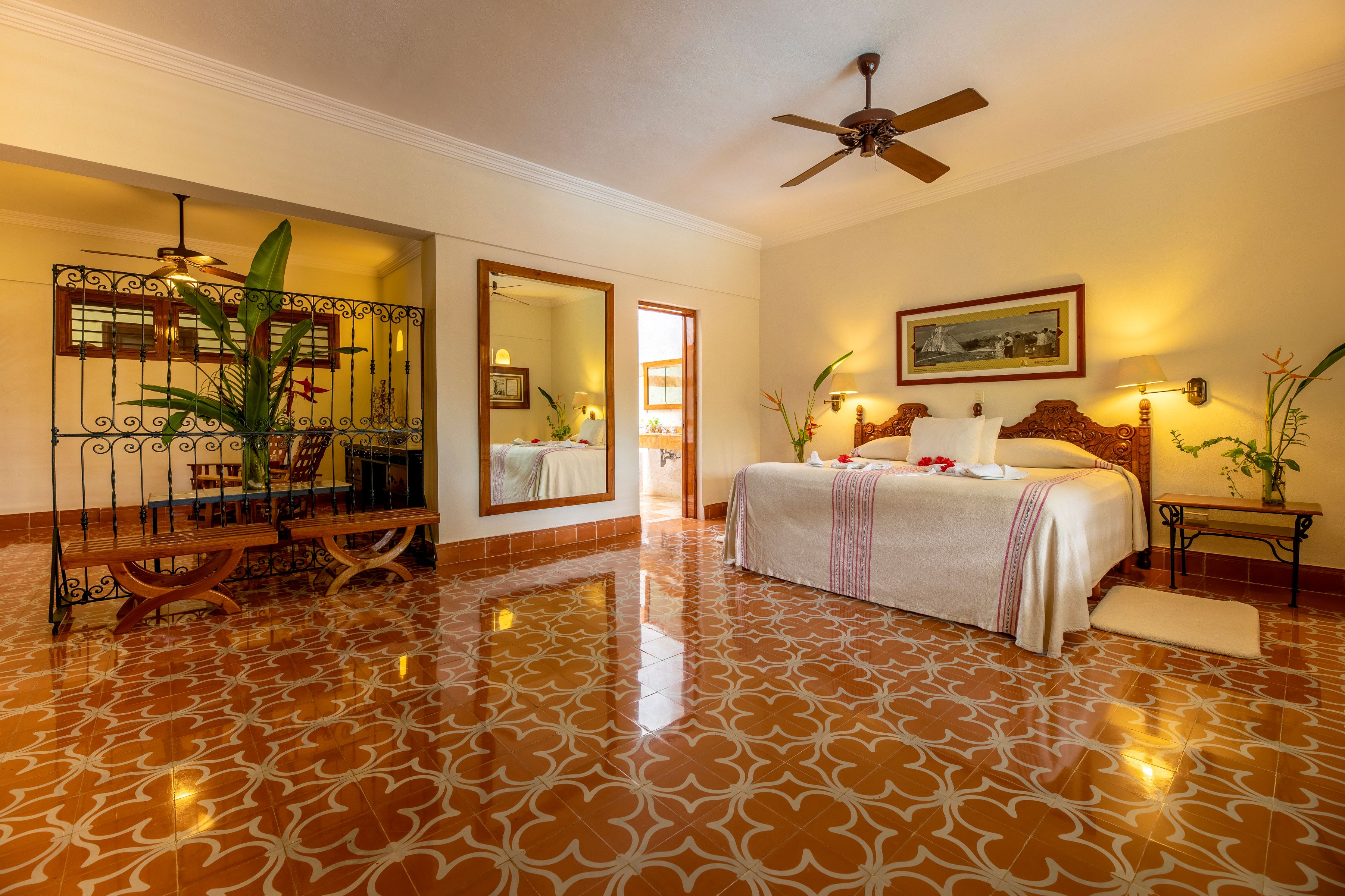 a bedroom with a bed and a ceiling fan