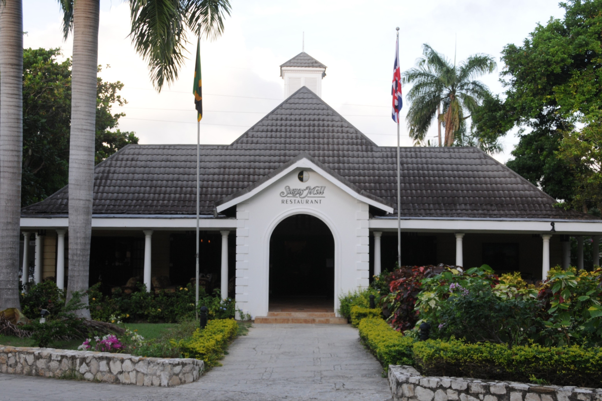 a building with a white roof and a black roof